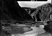 OVERVIEW OF WOODEN CCC TRAM CROSSING THE  COLORADO RIVER NEAR BRIGHT ANGEL CREEK CONFLUENCE. CIRCA 1935. NPS PHOTO