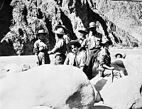 EIGHT PEOPLE BY COLORADO RIVER AT PHANTOM RANCH. HATTIE WALKER ON FAR LEFT. AUG 1911 PHOTO BY WALKER FAMILY