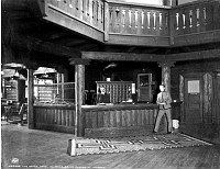 EL TOVAR HOTEL - THE OFFICE. FRONT DESK AREA. SWITCHBOARD. DESK CLERK & BELLMAN. CIRCA 1905. GRAND CANYON N.P. MUSEUM COLLECTION