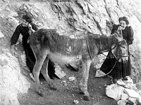 HUMOROUS POSE OF 2 HARVEY GIRLS USING A &quotDONKEY TELEPHONE." (PER EMERY KOLB) GRCA 30590. CIRCA 1906. KOLB BROS.