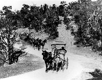 2 HORSE-DRAWN COACHES (FRED HARVEY) OF GRCA VISITORS TRAVELING ON NEWLY COMPLETED W RIM DRIVE. 05 NOVEMBER 1911. SMITH, NFS