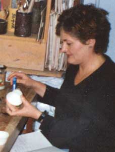 Student glazing a pot