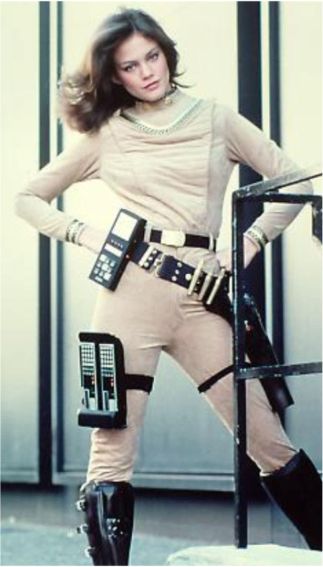 Maren Jensen as Athena wearing the beige warrior uniform