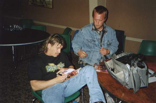 Eddy signs autographs