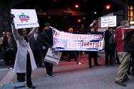 Billionaires for Bush (and Rove) greet Mavericks
-Photo by Fred Askew