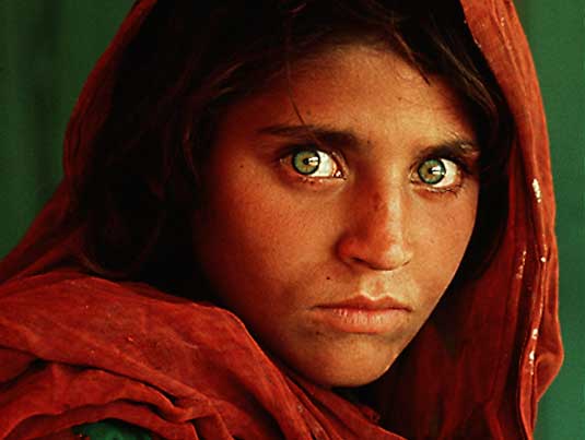 [The face of a 12 year old Afghani girl living in a refugee camp in Pakistan. National Geographic, 1985.]