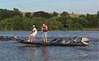 photo of bass boat with men fishing at the mouth of the Catskill Creek