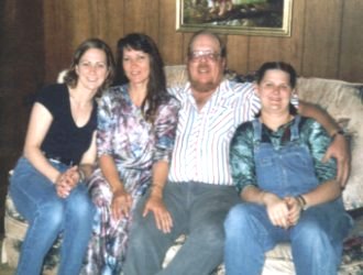 My Husband and I with our Daughters