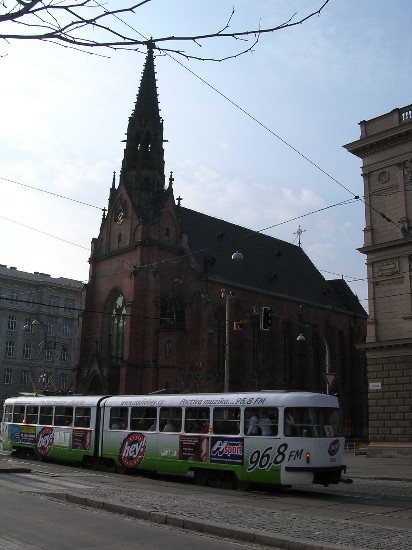 a tram on Jostova, running past the Red Church