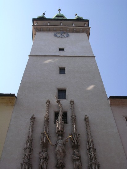the tower of Brno's town hall, with the gothic carvings over the door.