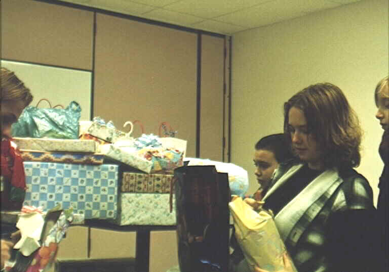 Allison begines to open the many gifts donated by St. George parishoners