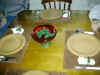 Burning holly candles floating on water in red bowl.jpg (94772 bytes)