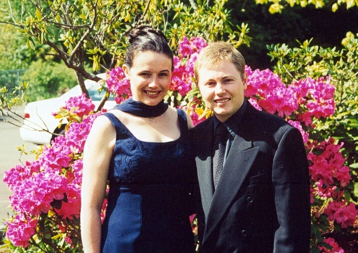 Jonathan and Felicity together in front of the flowers