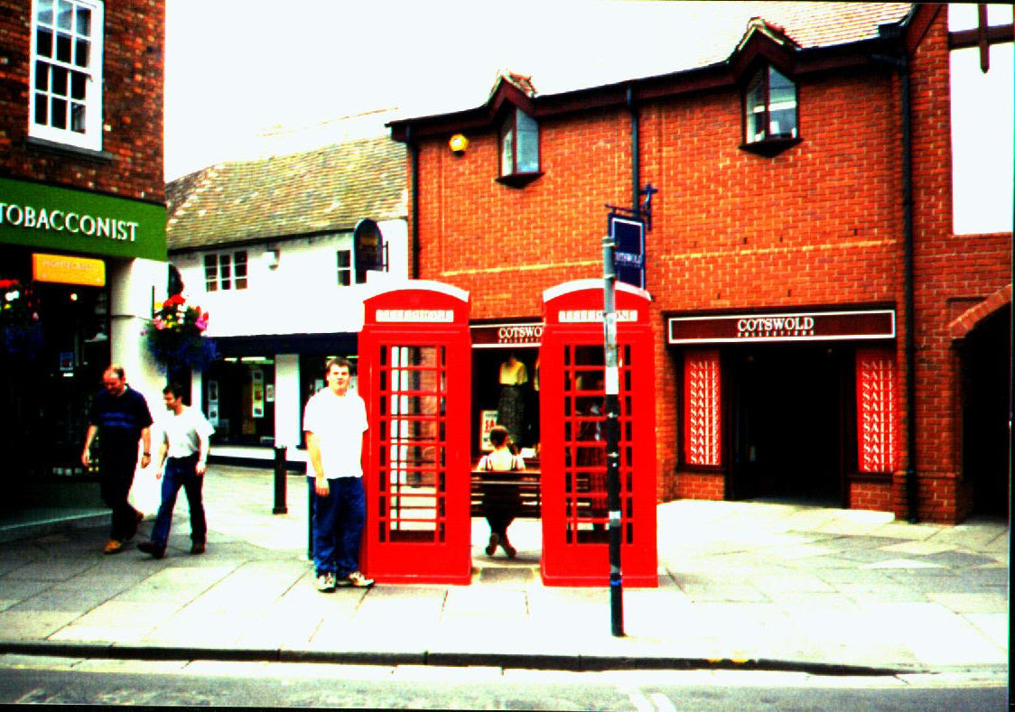 Standing outside a phone [box] with money in my pocket - June '99