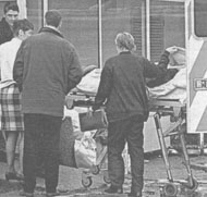 Wounded: Harrison arrives at hospital after the attack