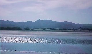 The hills of Al Hajar al Sharqi as seen from the beach at Al Khuwair, Muscat, Oman