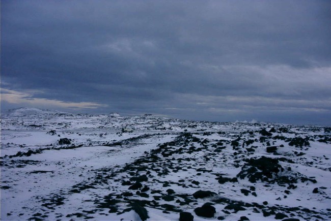 This is as close as I could drive to the beach, it's about a 100 yard walk over lava and through snow to the beach.&nbsp; Also, notice the steam from a hot spring on the right side on the horizon.