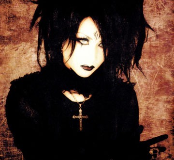 Mana, creative control of moi dix mois. I have seen only one photo where he smiles (and isn't dressed up).