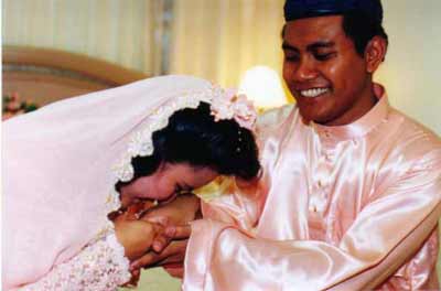 Bride kisses groom's hands