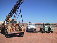 Photo of abandoned trucks in Coober Pedy, Australia