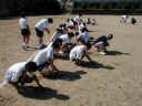 Students removing grass from the soccer "field".
