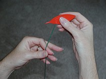 Holding the thread and shuttle