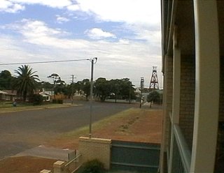 balcony view - summer rain clouds and street-scape