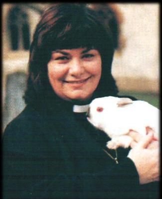 The Vicar of Dibley tending her sheep (or is it a rabbit!) 