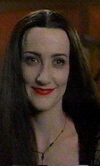 Ellie Harvie as Morticia