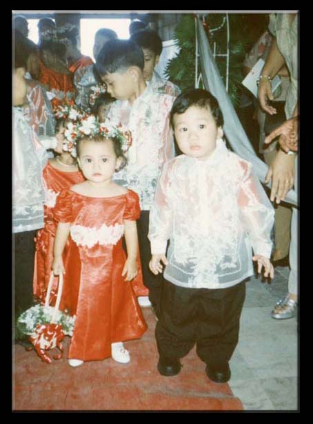 Daniel with girlfriend at a wedding