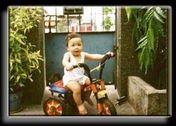 8 month old Diego enjoying his brother's bike