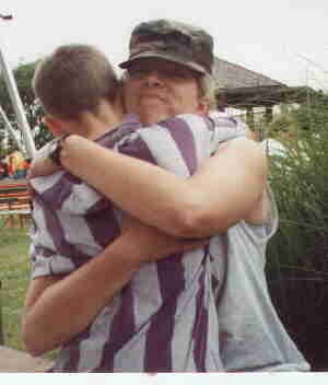 Troy hugging me after giving me his hat to shade my eyes