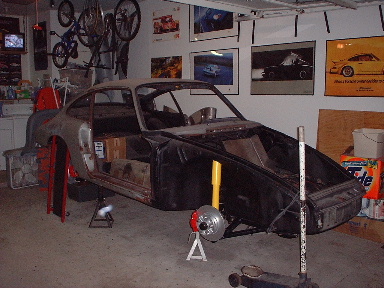 Click on pic for full-size image. Fenders and hood are straight and primed, but not back on the car yet-I'm worried about dents and scratches while I work on other parts of the car.