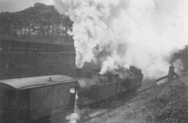 Two of Bromsgroove's 3F Jinty tanks assist at the rear of the train