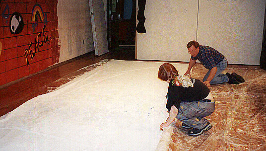 Mr. Schaffer and his son Chris Schaffer examine the backdrop.