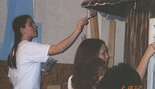 Kate Welsh and Tara Ferdelman paint the shack.