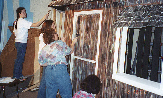 Kate Welsh, Tara Ferdelman, Mrs. Lisa Schaffer, and Mrs. Tina Jacoby Welsh paint the shack.
