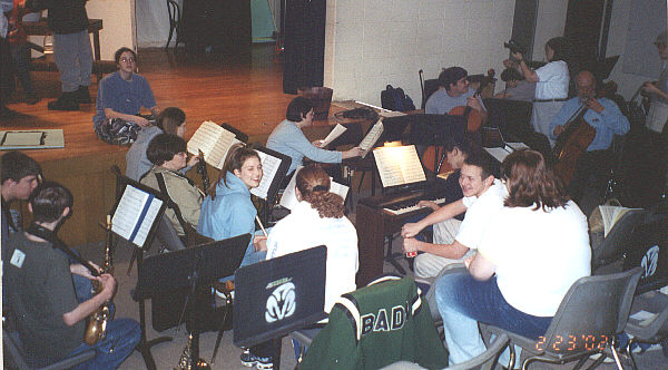 The Orchestra gets ready for rehearsal.