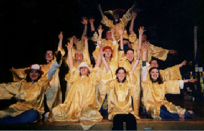 Kate (on top) and the Players sing We Beeseech Thee