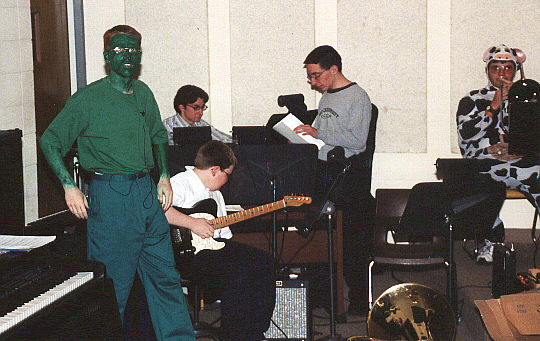 (L to R) Joel Sackenheim, Jeff Long (drums), Tom Long (guitar), Scott Long, Tom Mitchell (trombone/cow)