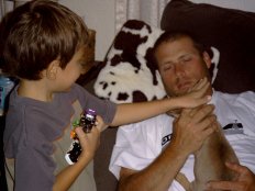 Fyedya petting puppy with Chuck