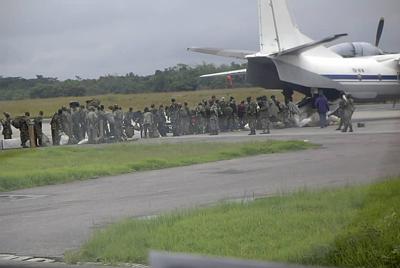 Rebels queue for slide before stealing it using attatched heliocopter