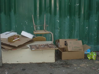 Miscellaneous garbage piled behind the woodshop