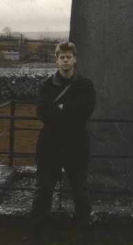 [Pensive, dressed in black -- must be a rock star!]