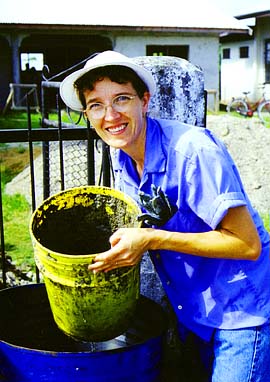 Lory Morgan fills a bucket