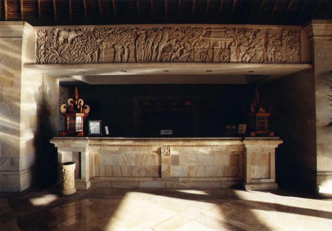 Reception Desk in Lobby of Le Meridien Hotel with carved stone panel over