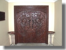 Carved entry doors to Spa Entry Court