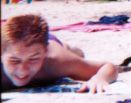 Brad appears to be in great pain on the beach LOL