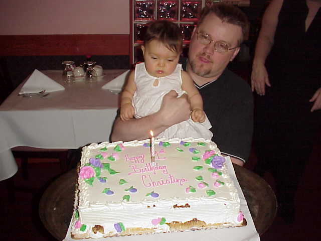 Proud Dad John hoists the birthday girl!