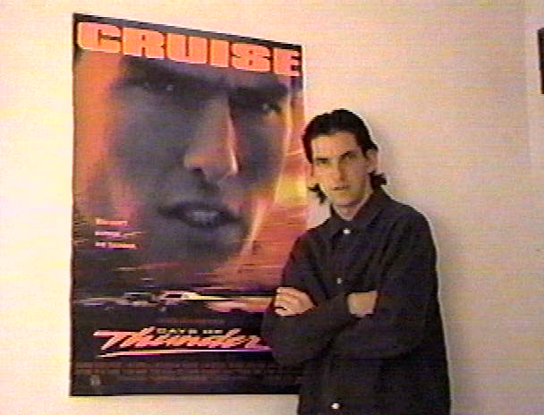 heres me posing beside the Paramount Days of Thunder Poster in the green room